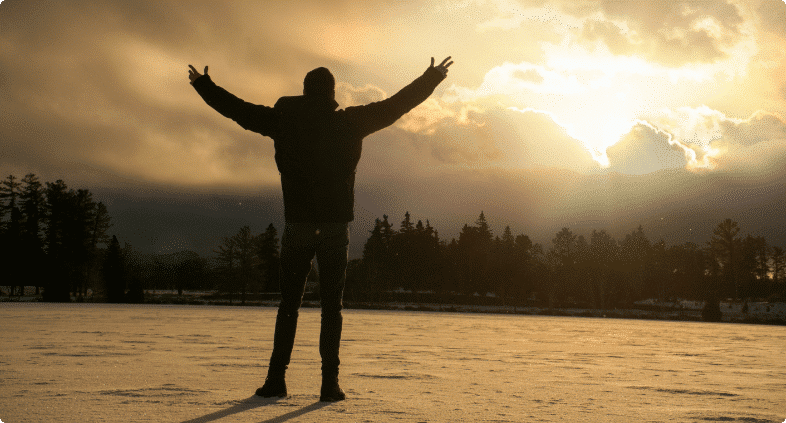 Keir standing in front of a lake